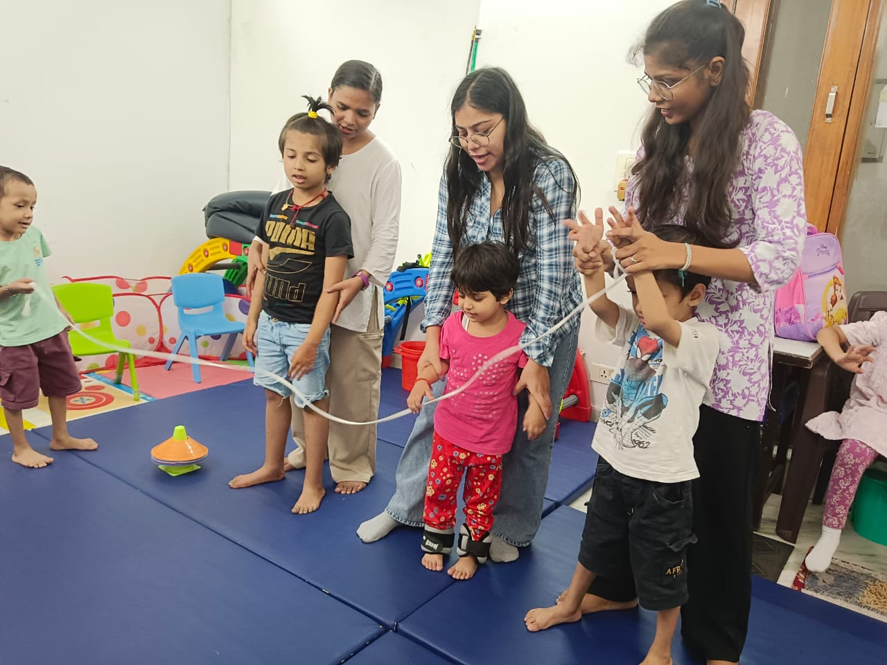 Therapy session with therapist guiding child